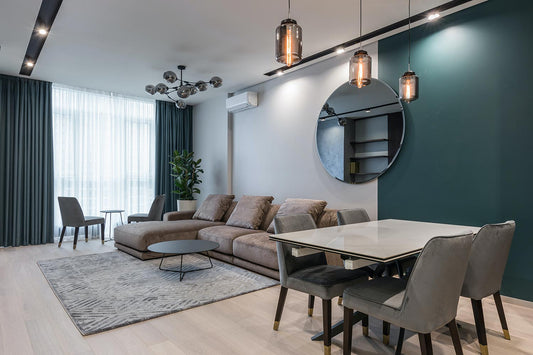 living room with grey couches and chairs and a dramatic accent wall